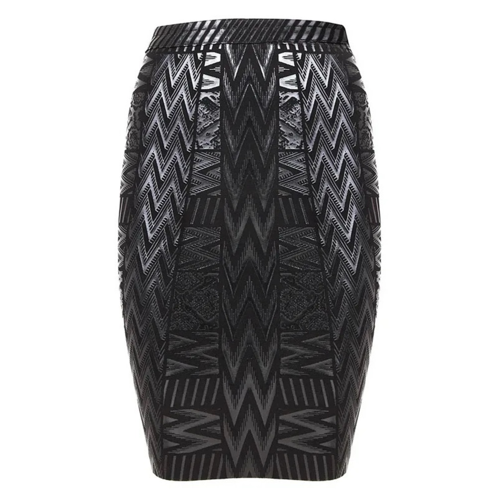 Embossed lined contoured fit skirt cut on the knee.